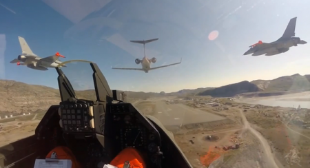 F-16 and other aircraft low over runway